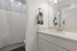 Bathroom with vanity and toilet