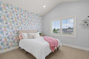 Bedroom featuring lofted ceiling, carpet flooring, and recessed lighting
