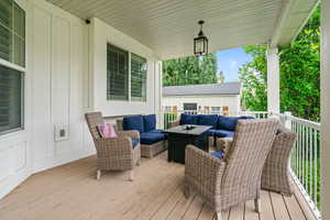 Wooden deck featuring an outdoor hangout area