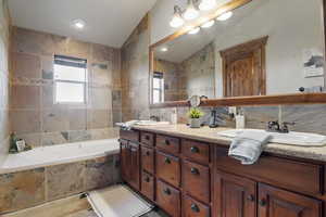Primary bathroom featuring jetted tub.