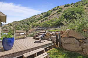 Wooden deck featuring a mountain view