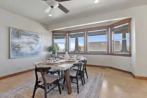 Dining area featuring ceiling fan, recessed lighting, and light tile patterned floors