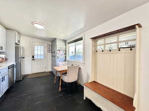 Delightful kitchen and dining space!!  Lovely window view!