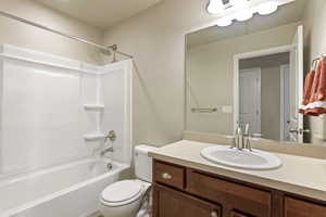 Bathroom with vanity and bathtub / shower combination