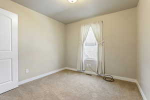 Spare room with carpet floors