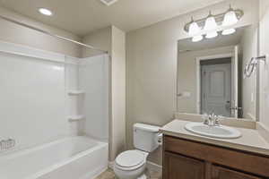 Full bathroom featuring vanity and shower / bathtub combination