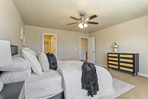 Bedroom with light carpet and ceiling fan