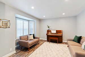 Living area featuring light wood-type flooring, recessed lighting, and plenty of natural light
