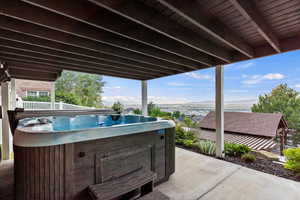 View of patio / terrace featuring a hot tub