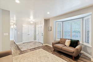 Entrance foyer featuring wood finished floors and recessed lighting