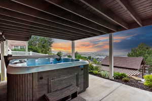 View of patio featuring a hot tub