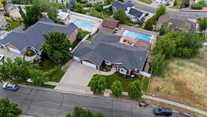 Aerial perspective of suburban area featuring a pool area