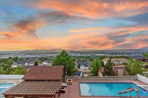 View of pool featuring a fenced backyard, a residential view, and a water slide