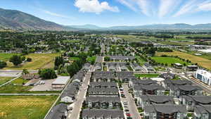 Aerial view of residential area featuring a mountainous background