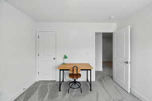 Office with carpet floors and baseboards