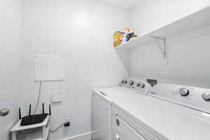 Laundry room featuring washer and clothes dryer