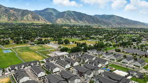 Aerial overview of property's location with nearby suburban area and a mountain backdrop