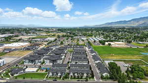 Aerial view of residential area featuring a mountainous background