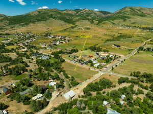 Aerial overview of property's location featuring mountains
