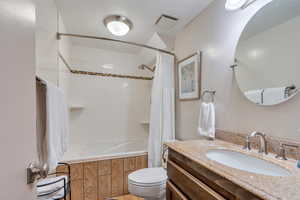 Full bath with shower / bathtub combination with curtain and vanity