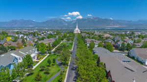 Aerial perspective of suburban area with a mountainous background