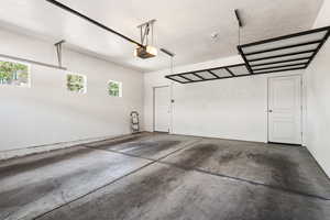 Garage featuring a garage door opener