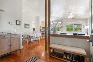 Interior space with ceiling fan, wood finished floors, recessed lighting, and a textured ceiling