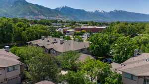 Aerial perspective of suburban area featuring a mountainous background