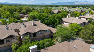 Aerial perspective of suburban area with a mountain backdrop