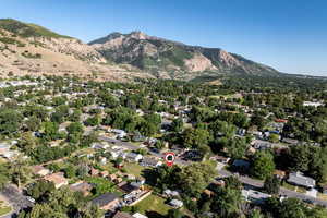 Aerial view of property's location with a mountain backdrop