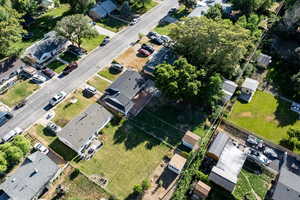 Aerial view of property's location with nearby suburban area