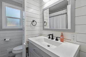 Bathroom featuring vanity and crown molding