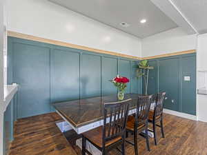 Dining space featuring custom table and bench seating. (Table can stay with the home if buyer wants to keep it).