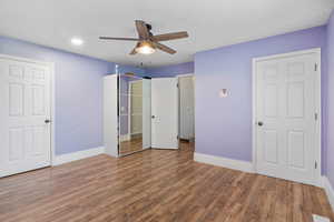 Unfurnished bedroom with wood finished floors, a ceiling fan, and recessed lighting