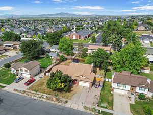 Aerial perspective of suburban area featuring a mountain backdrop