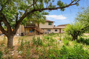 Back of property featuring stairway
