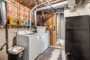 Washroom with washing machine and clothes dryer