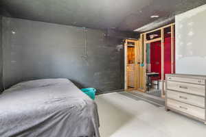 Bedroom with concrete floors