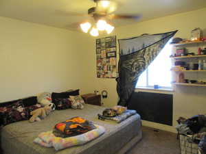 Bedroom 2 with carpet flooring and a ceiling fan
