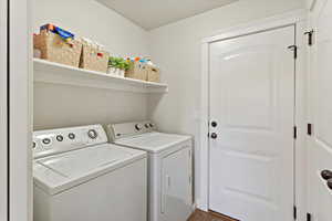 Laundry room with washing machine and dryer