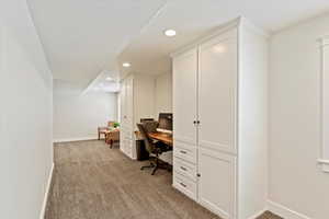 Office area featuring recessed lighting and light carpet