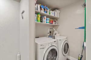 Laundry room featuring independent washer and dryer