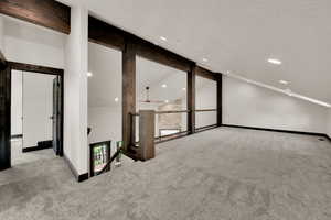 Unfurnished room with carpet, recessed lighting, and a textured ceiling