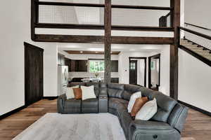 Living area featuring wood finished floors and baseboards