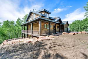 View of front of house with covered porch and a garage