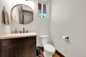 Bathroom featuring vanity and wood finished floors