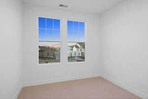 Unfurnished room featuring carpet