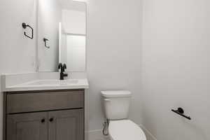 Bathroom with toilet and vanity
