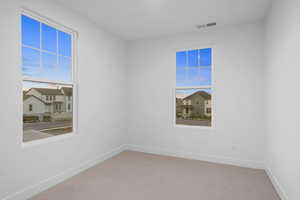 Unfurnished room featuring carpet floors