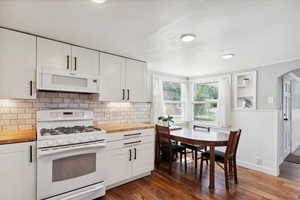 Custom kitchen with butcher block countertops. Views of the mountains from the eat in kitchen. Bright and spacious.